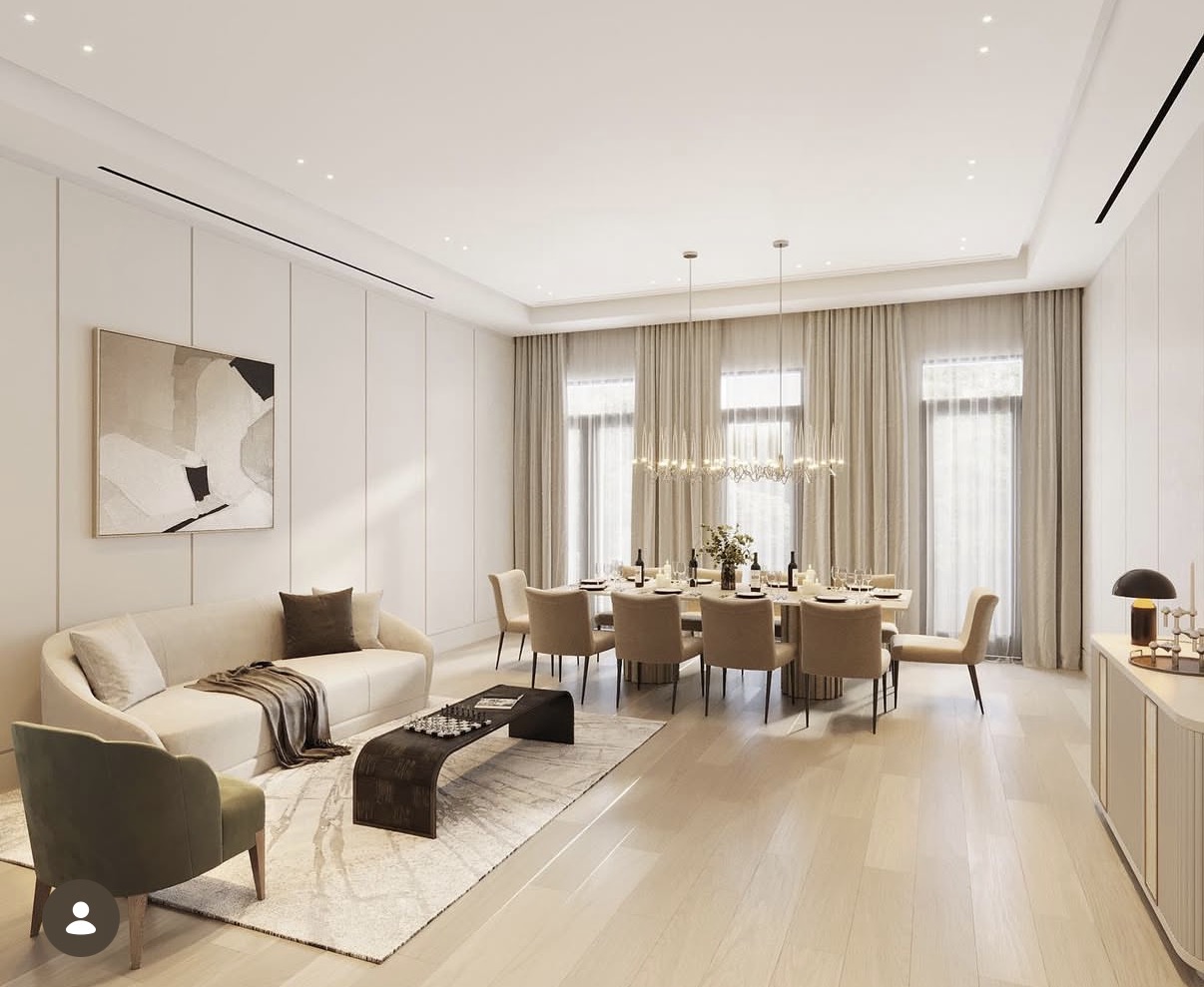 Open living and dining area with panelled walls and layered upholstery