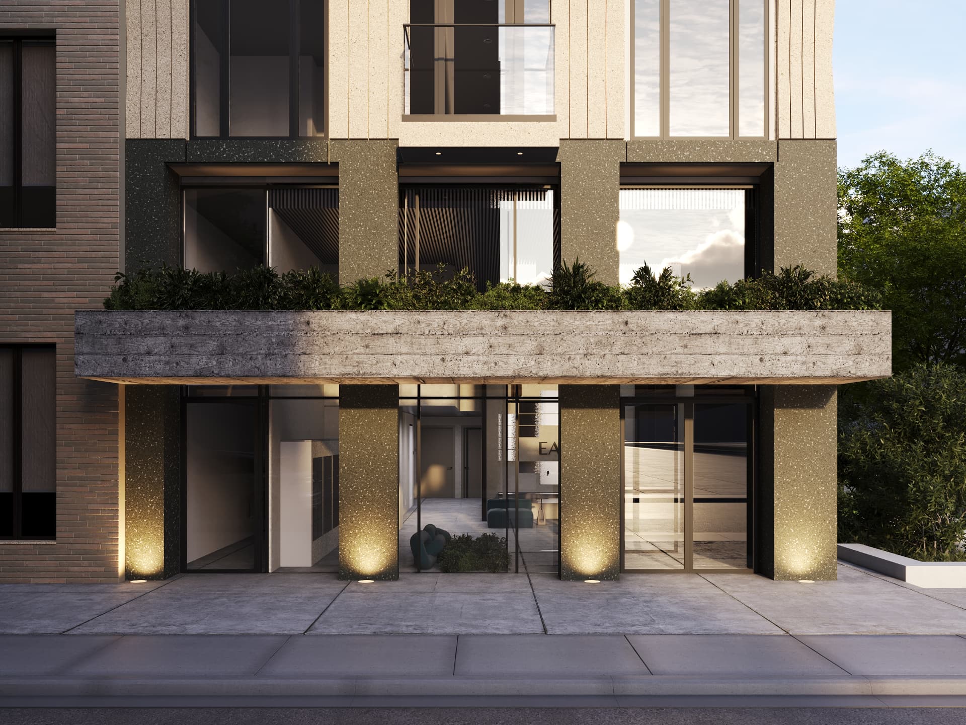 Entry canopy with board-formed concrete and planting at dusk