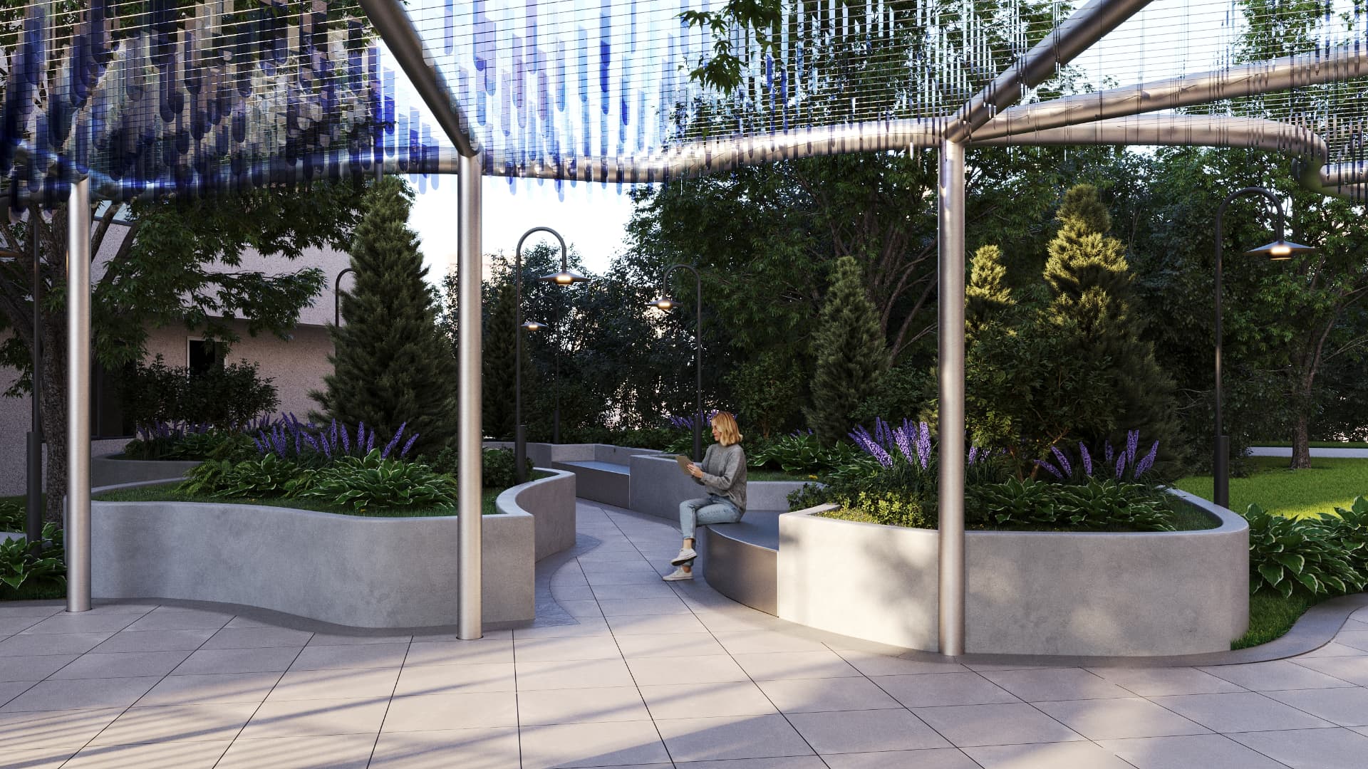Curved concrete seat walls and lavender planting under the glass canopy at dusk