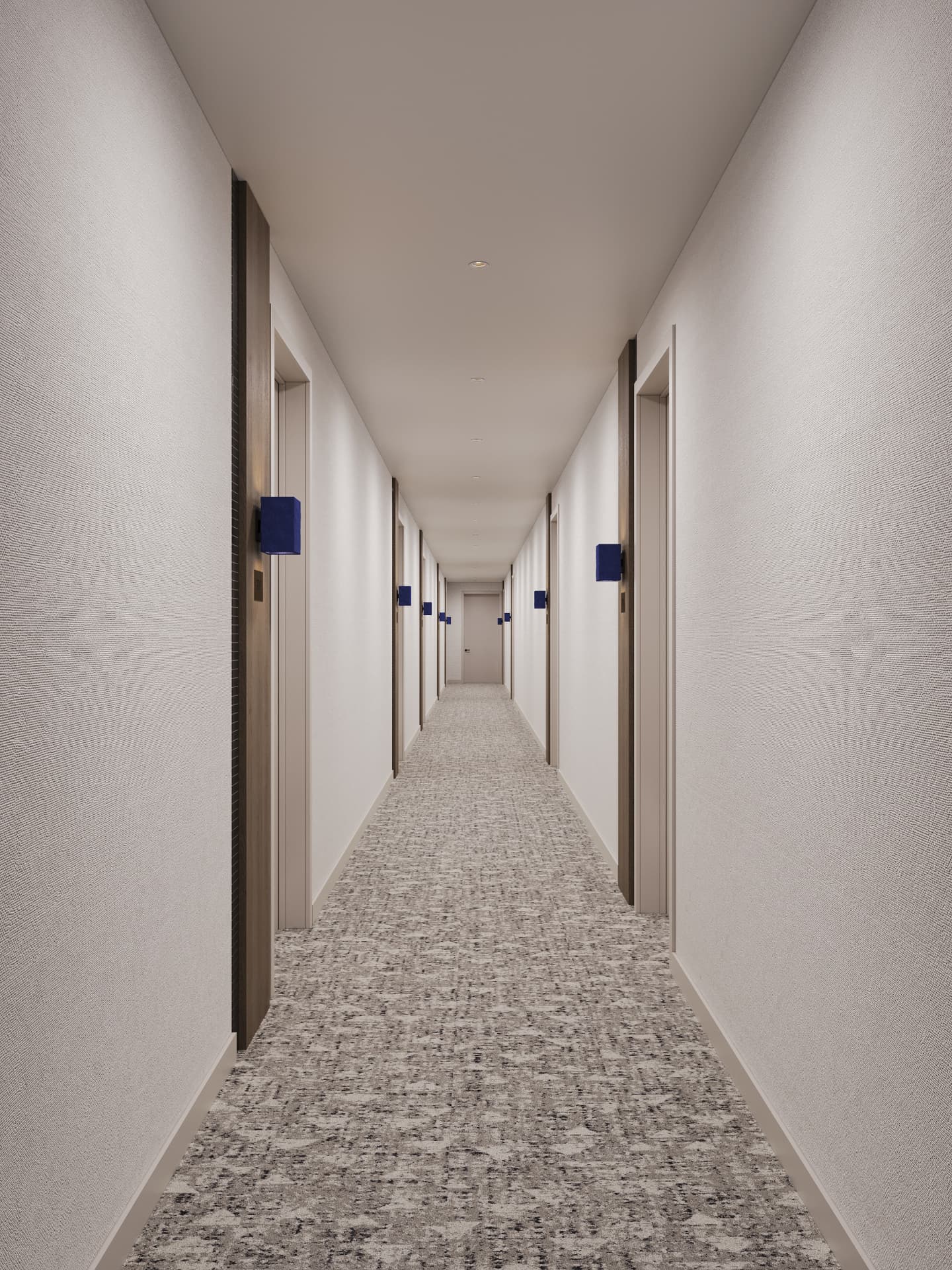 Residential corridor with textured linen walls, walnut door reveals and cobalt sconces