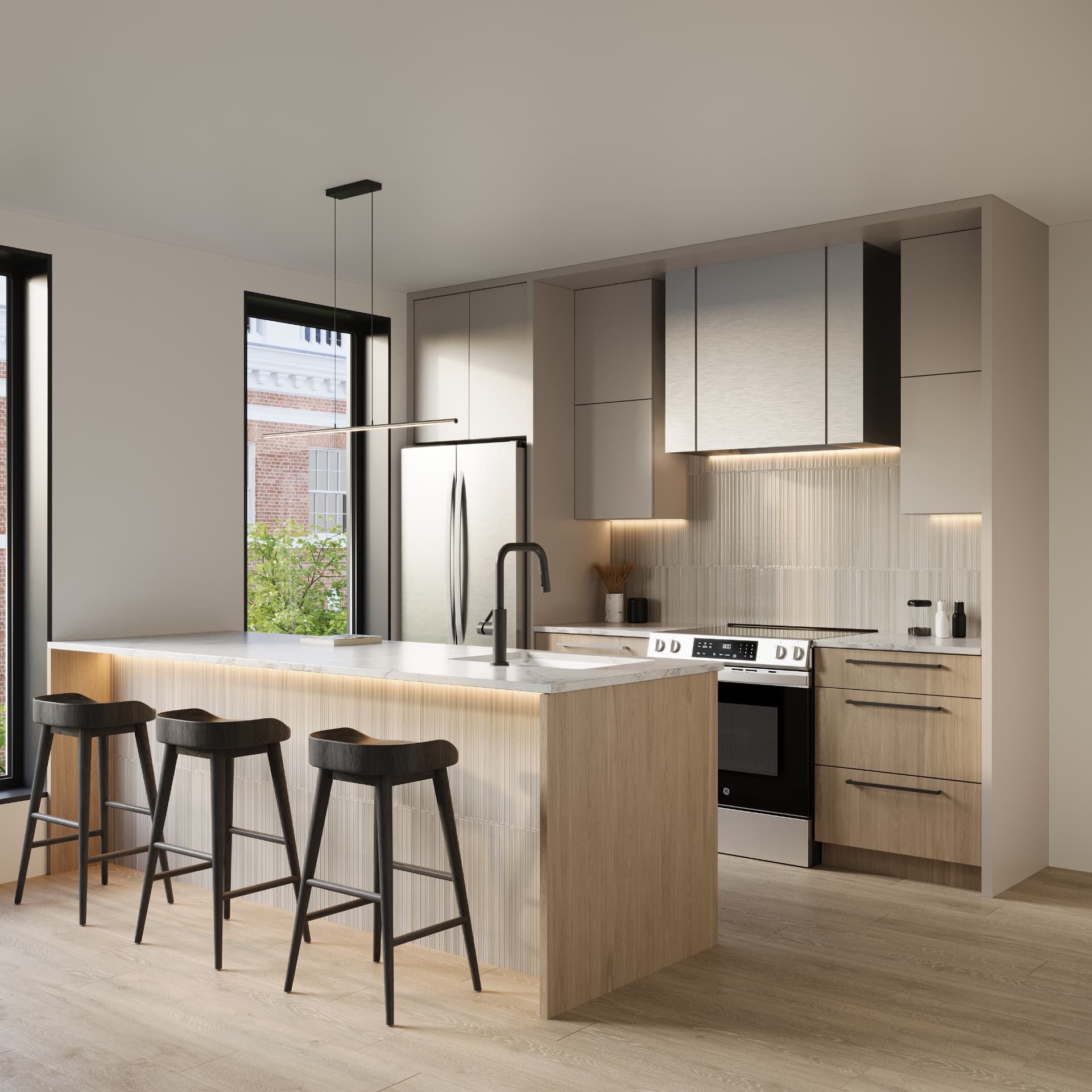 Residence kitchen with fluted island, marble counters and blackened oak stools