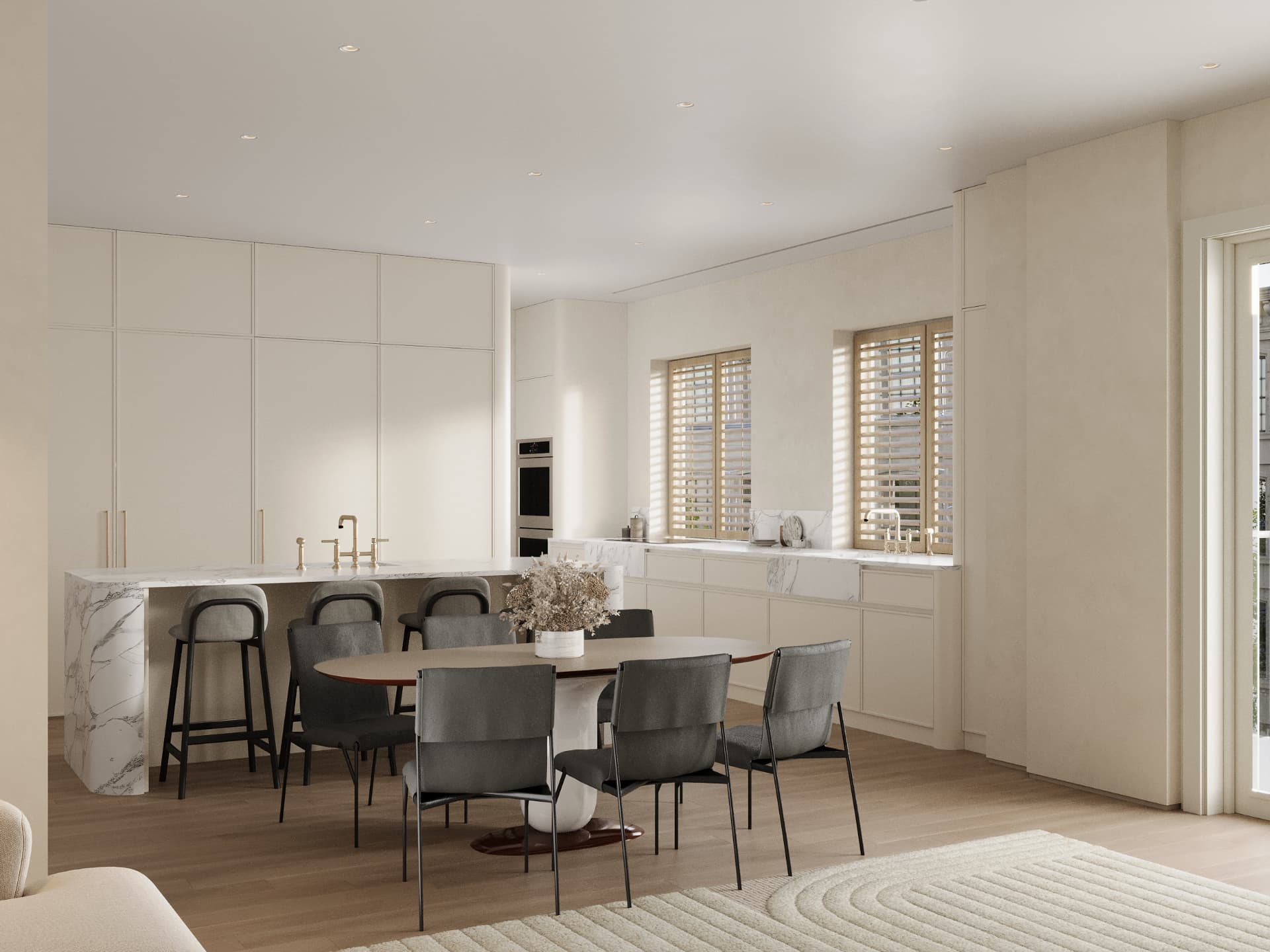 Kitchen and dining area with stone counters and brass fixtures
